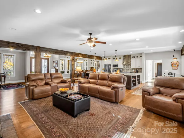 a large kitchen with a table and chairs