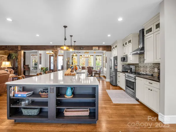 a large kitchen with lots of counter space a sink and appliances