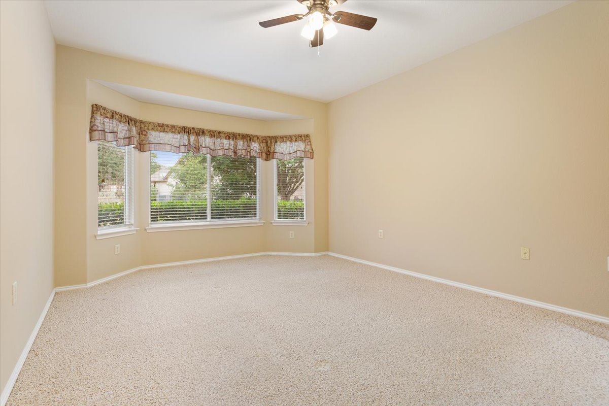 246 Red Poppy Trail Georgetown, TX 78633 - Photo 17 of 32 a view of an empty room with a window
