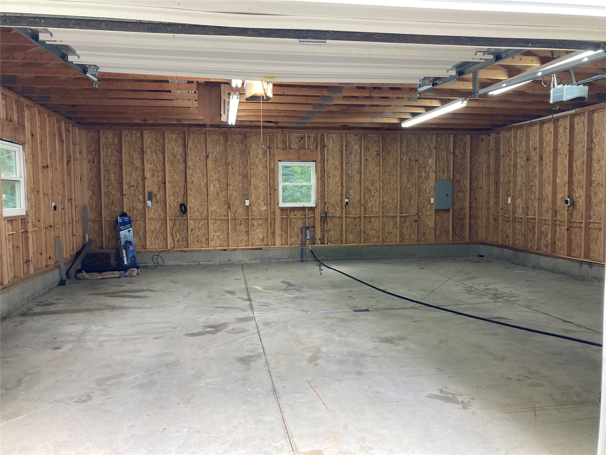 301 Stuart Way Erie, PA 16509 - Photo 50 of 50 Interior of extra garage at rear of property has both water and electric