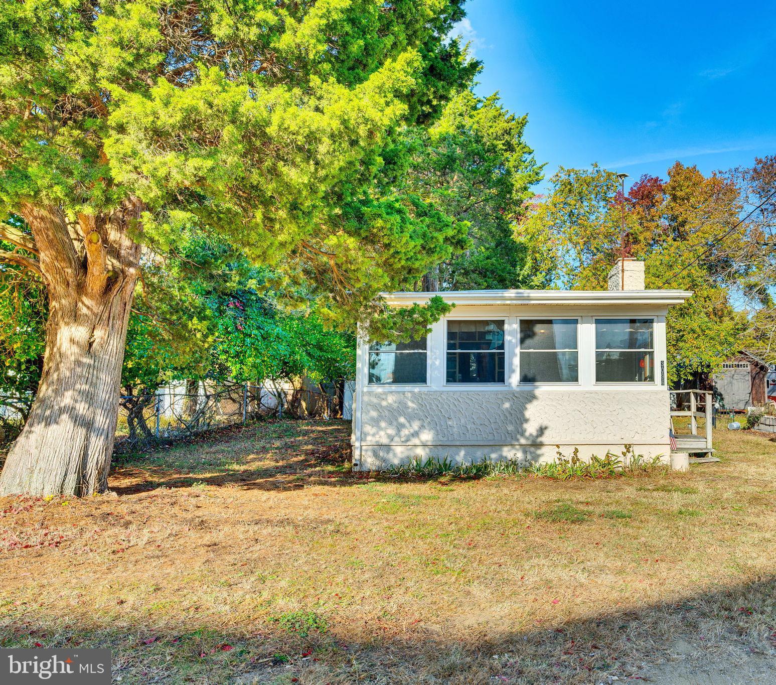 3096 Calvert Boulevard Lusby, MD 20657 - Photo 3 of 21 a front view of a house with a garden