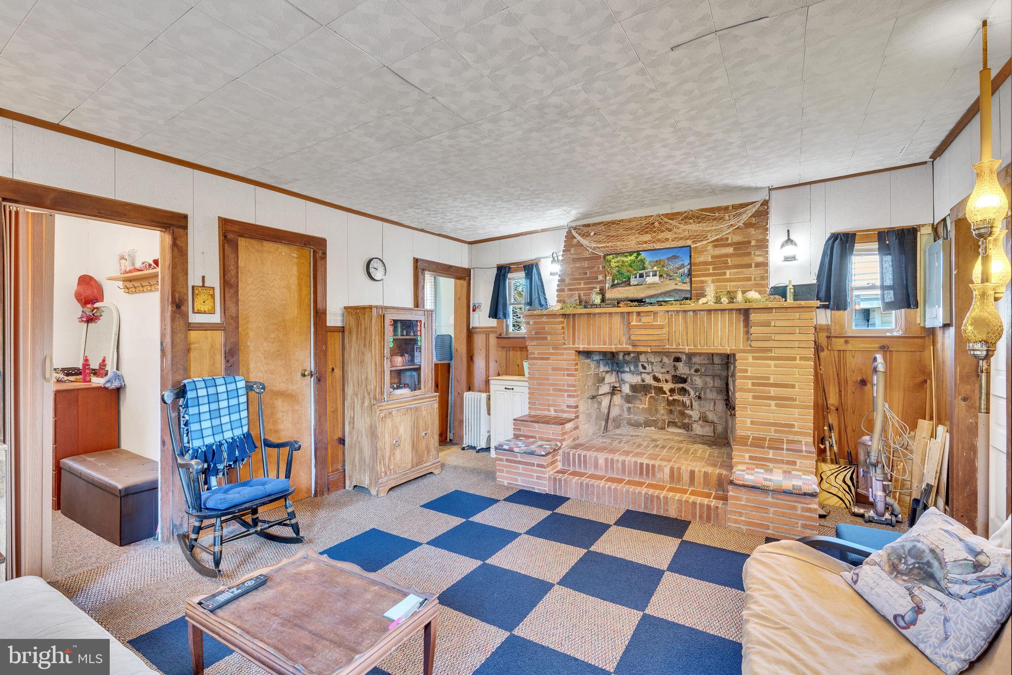 3096 Calvert Boulevard Lusby, MD 20657 - Photo 6 of 21 a living room with furniture and a floor to ceiling window