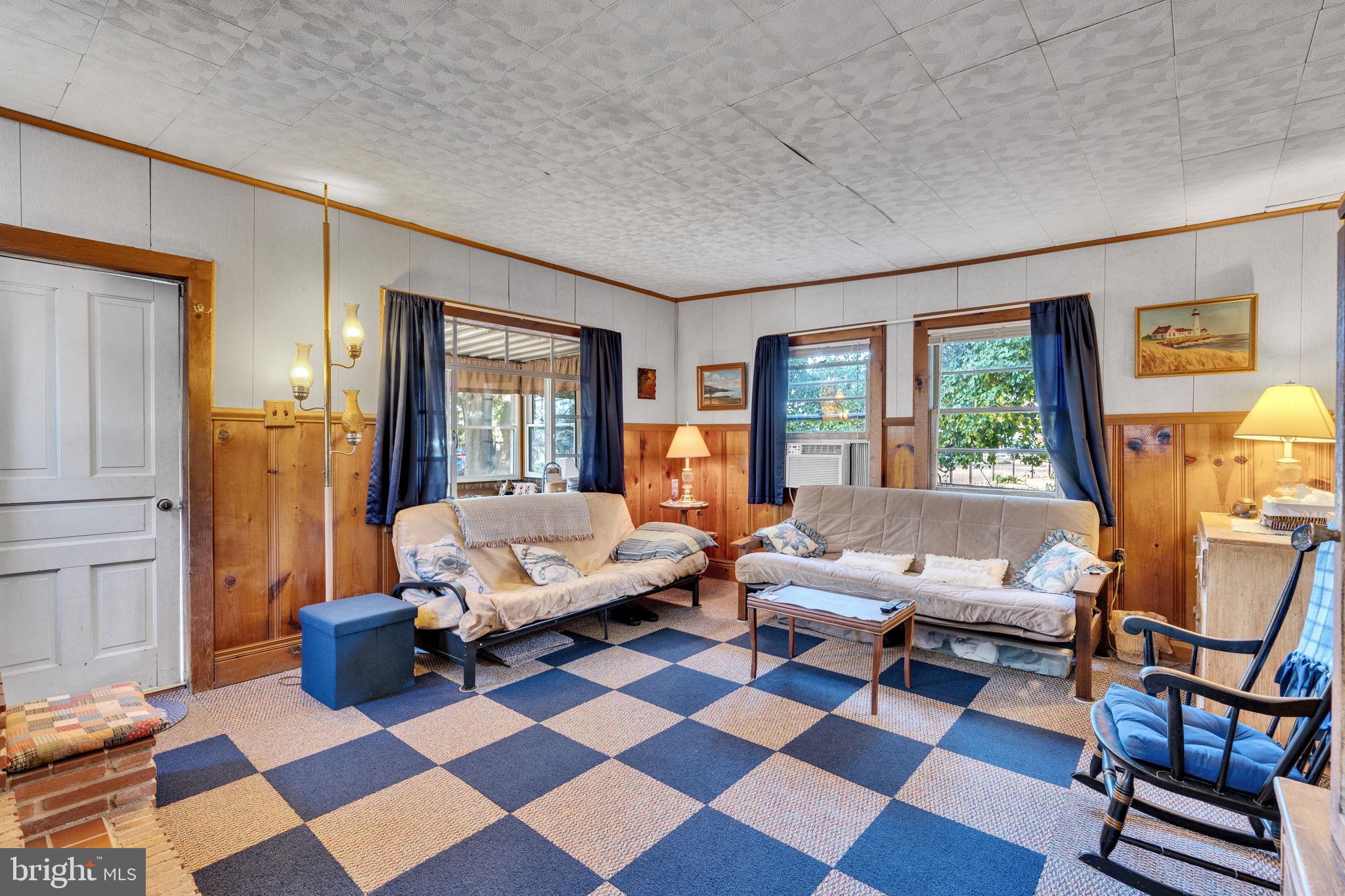 3096 Calvert Boulevard Lusby, MD 20657 - Photo 7 of 21 a living room with furniture and a rug
