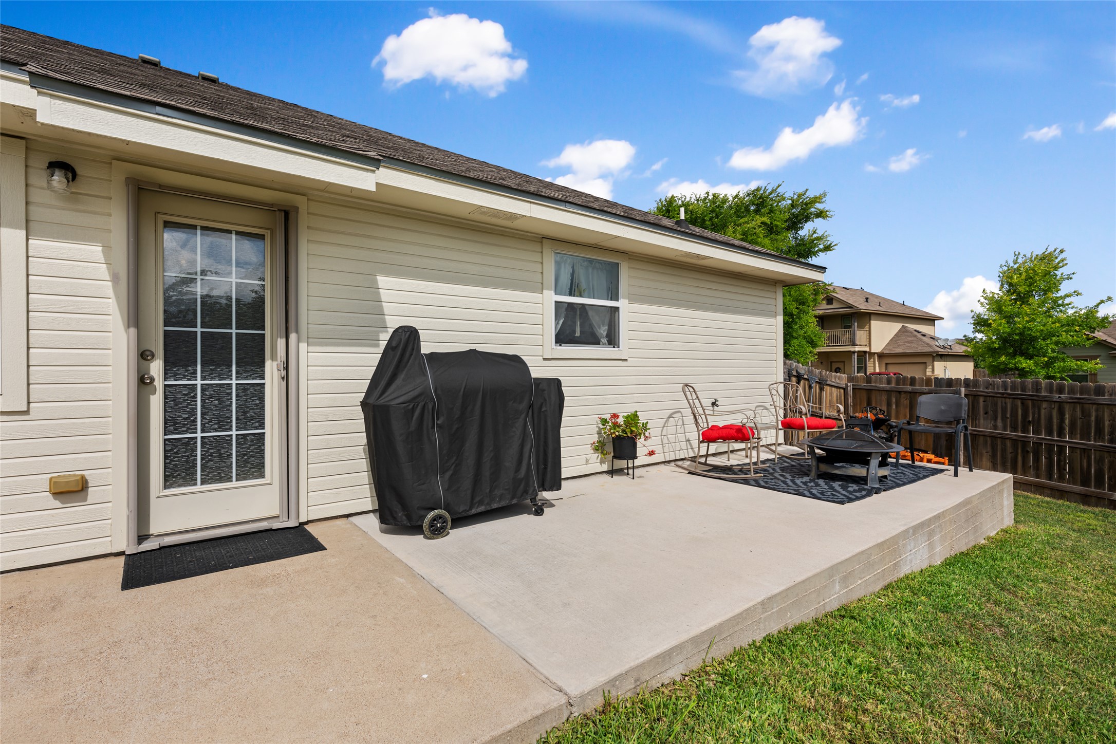 144 Calcite Lane Jarrell, TX 76537 - Photo 29 of 38 A private backyard patio offers ample space for outdoor relaxation and entertaining.