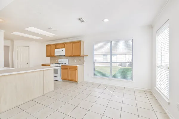 a view of an empty room with glass door