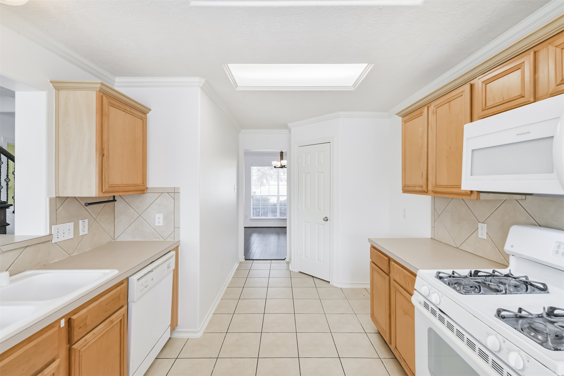 2507 Liza Court Spring, TX 77388 - Photo 12 of 37 a kitchen with a sink stove and refrigerator