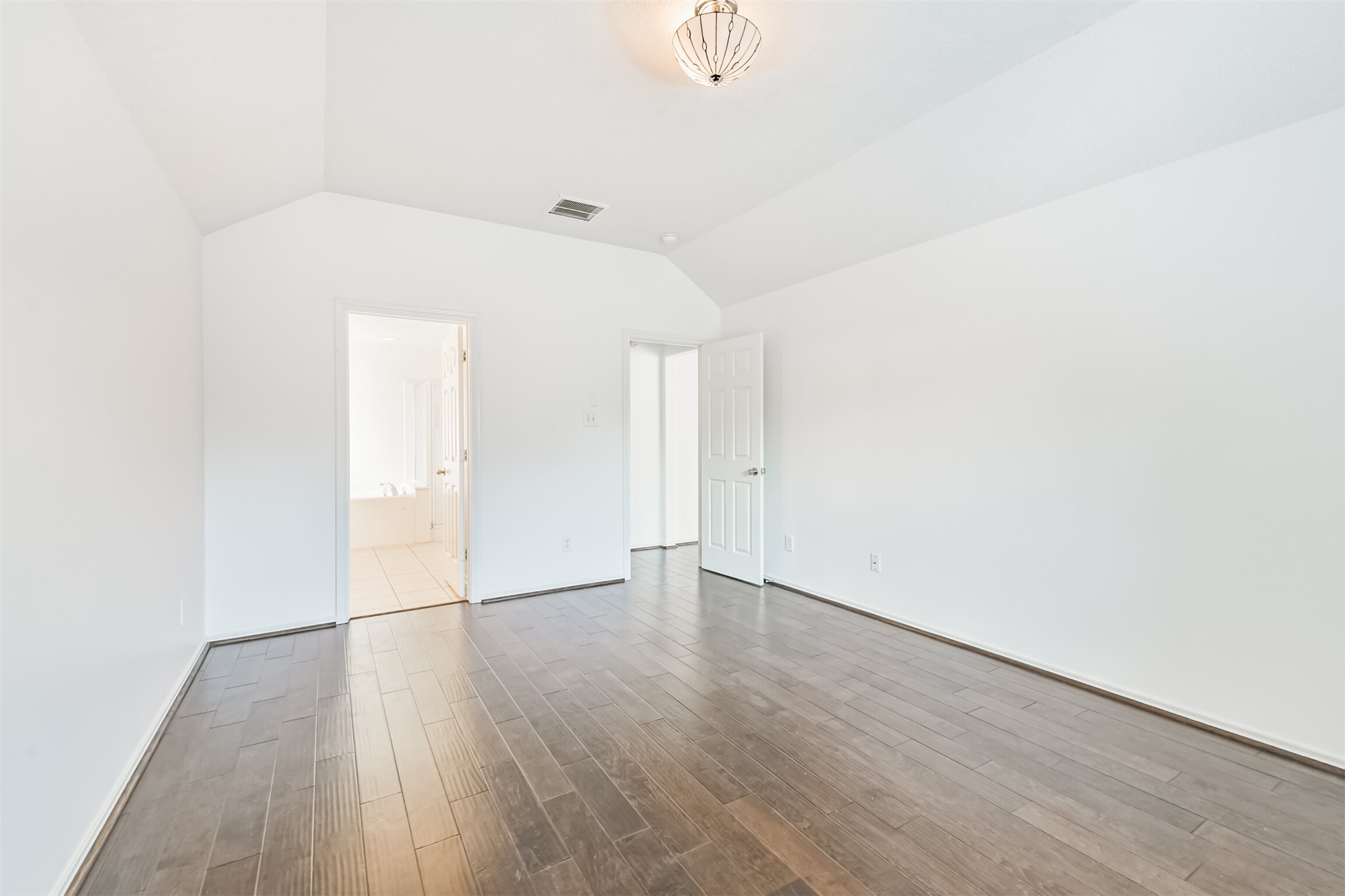 2507 Liza Court Spring, TX 77388 - Photo 19 of 37 a view of an empty room with wooden floor