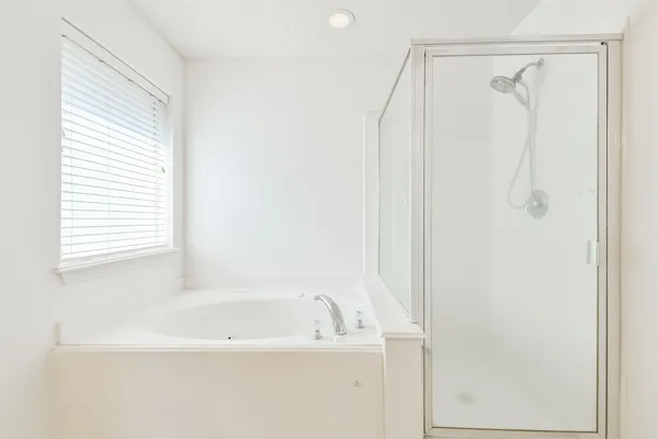 a bathroom with a sink a vanity and bathtub