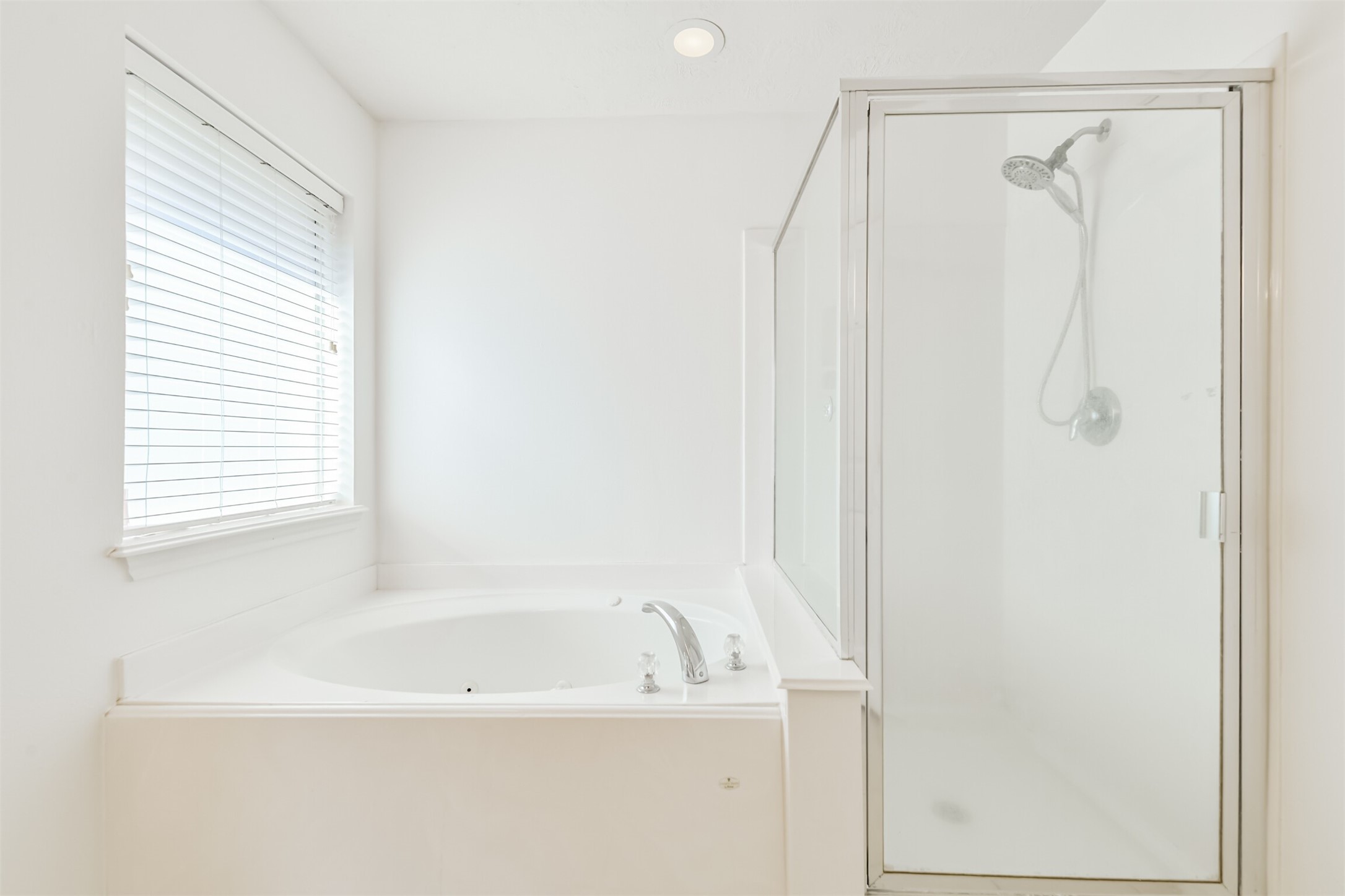 2507 Liza Court Spring, TX 77388 - Photo 21 of 37 a white bath tub sitting next to a shower