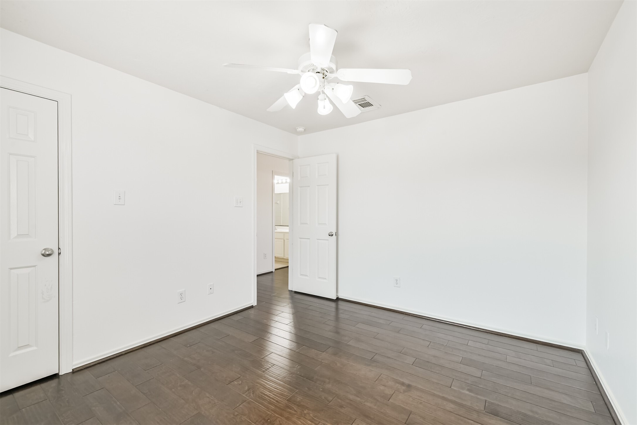2507 Liza Court Spring, TX 77388 - Photo 28 of 37 an empty room with wooden floor and ceiling fan