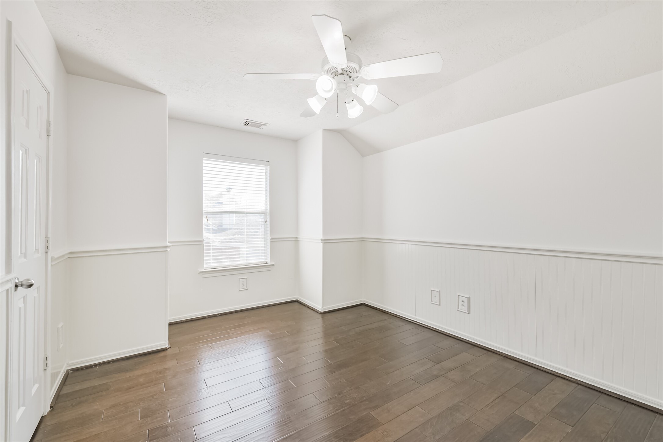 2507 Liza Court Spring, TX 77388 - Photo 30 of 37 an empty room with wooden floor and windows
