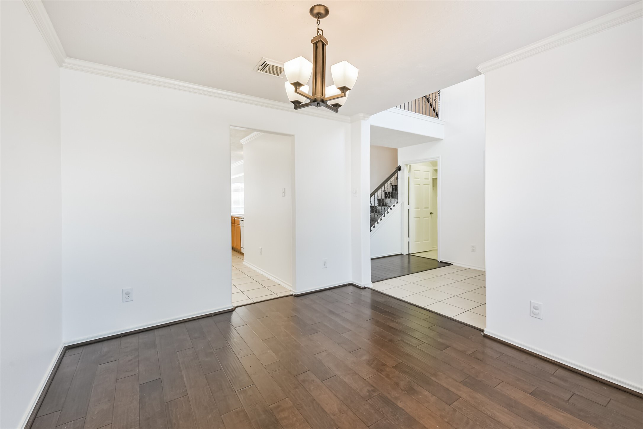 2507 Liza Court Spring, TX 77388 - Photo 5 of 37 a view of a hallway with wooden floor and staircase