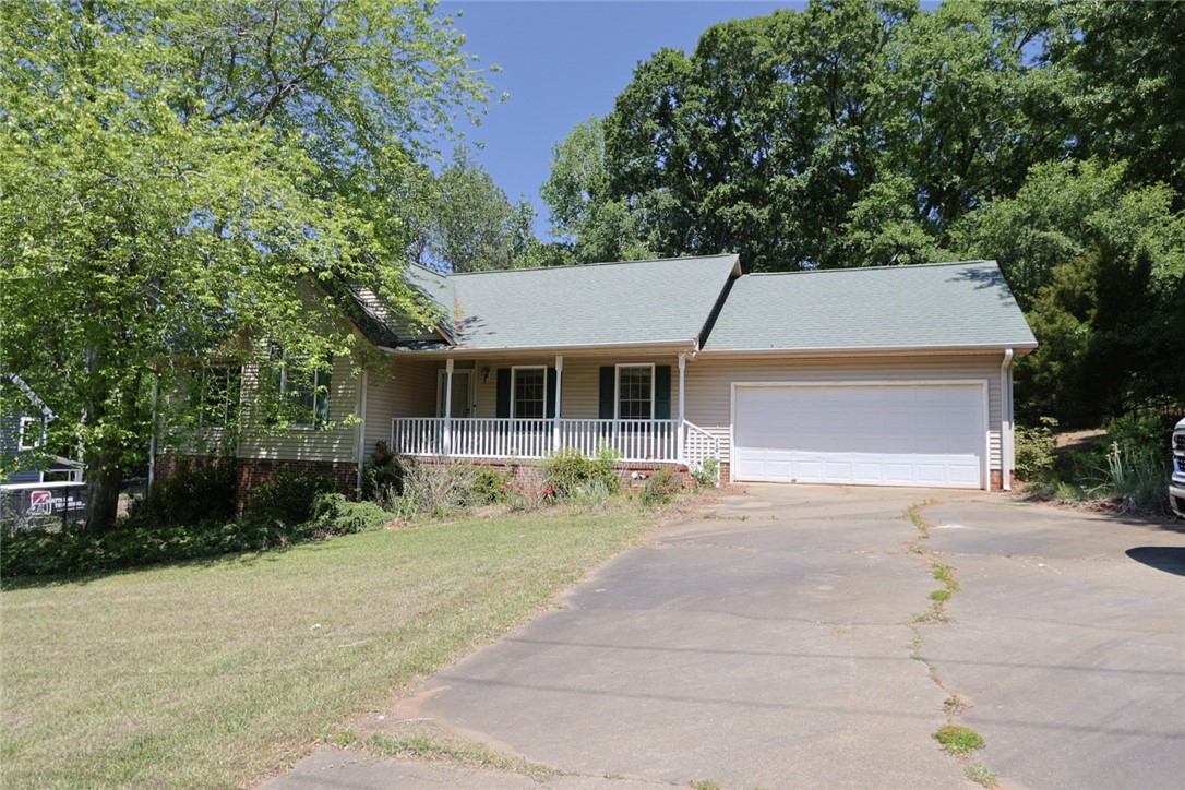This charming residence features a classic facade and a convenient attached garage.