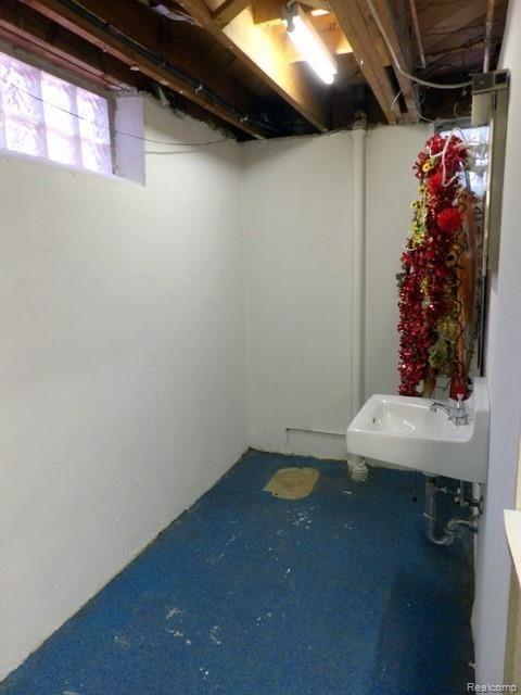 19226 Champaign Road Allen Park, MI 48101 - Photo 69 of 78 68. SEPARATE ROOM IN BASEMENT WITH WALK-IN SHOWER + ANOTHER SINK + PLUMBED FOR TOILET!
