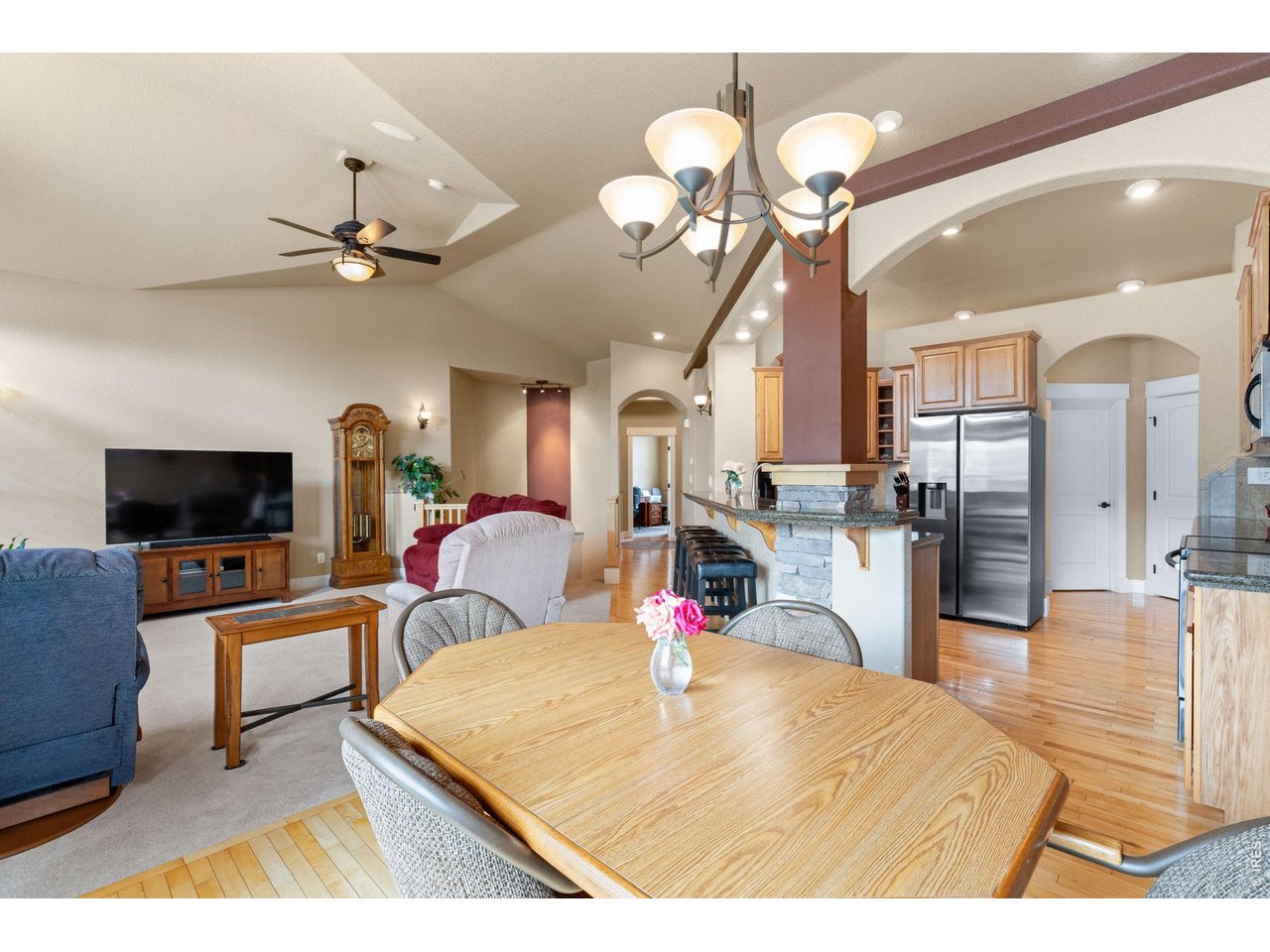 6710 31st St Road Greeley, CO 80634 - Photo 15 of 41 Welcoming great room feel with dining, family and kitchen
