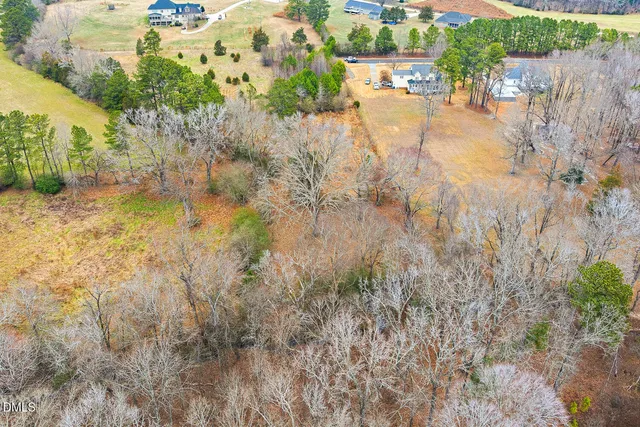 a view of a lake with a yard