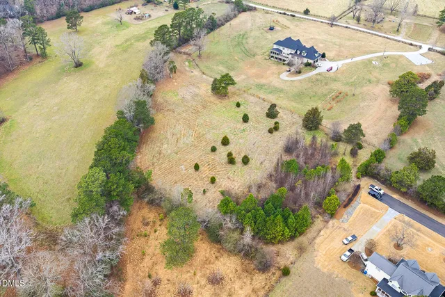 a view of a swimming pool with a yard