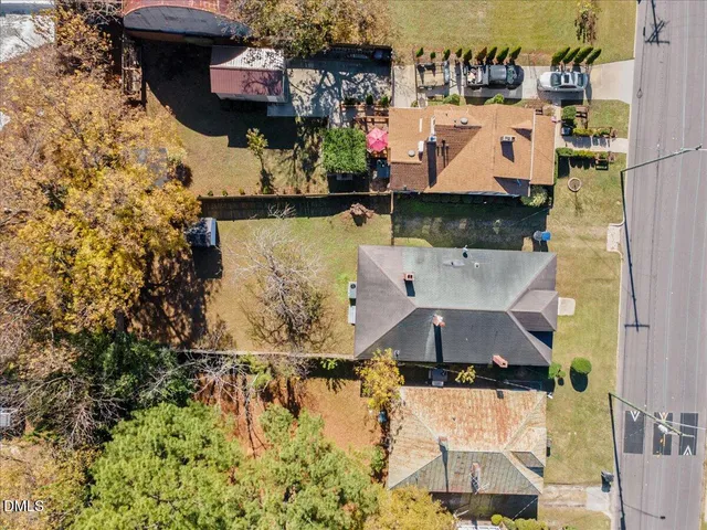 an aerial view of a house with a ocean view