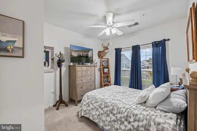a view of a dining room with furniture a chandelier and wooden floor