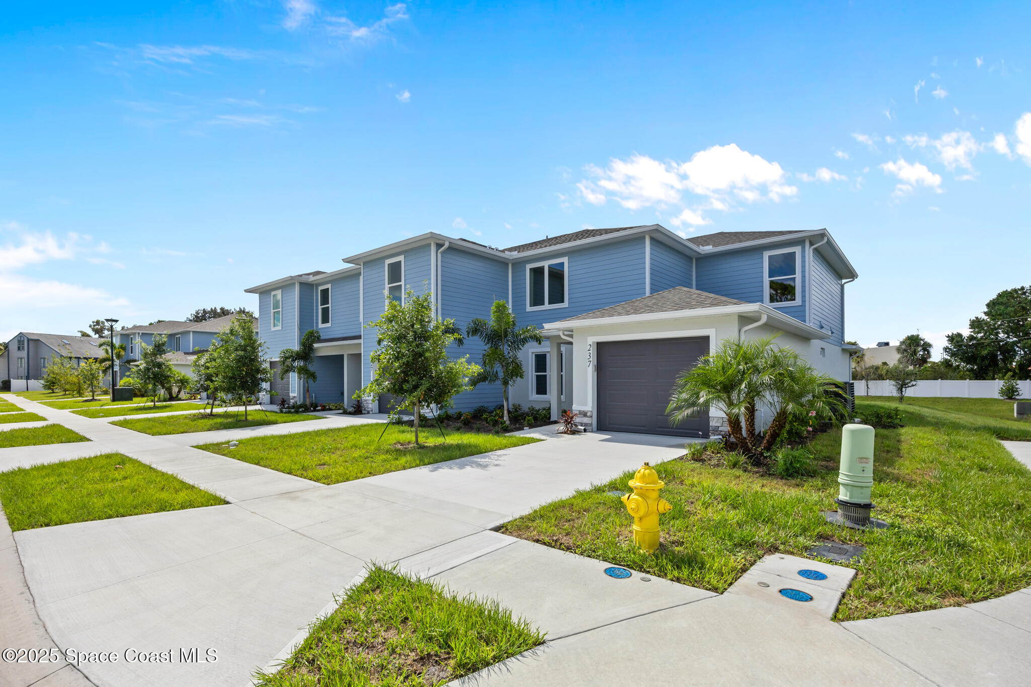168 Hidden Wds Place Melbourne, FL 32901 - Photo 1 of 31 a front view of a house with a yard and garage