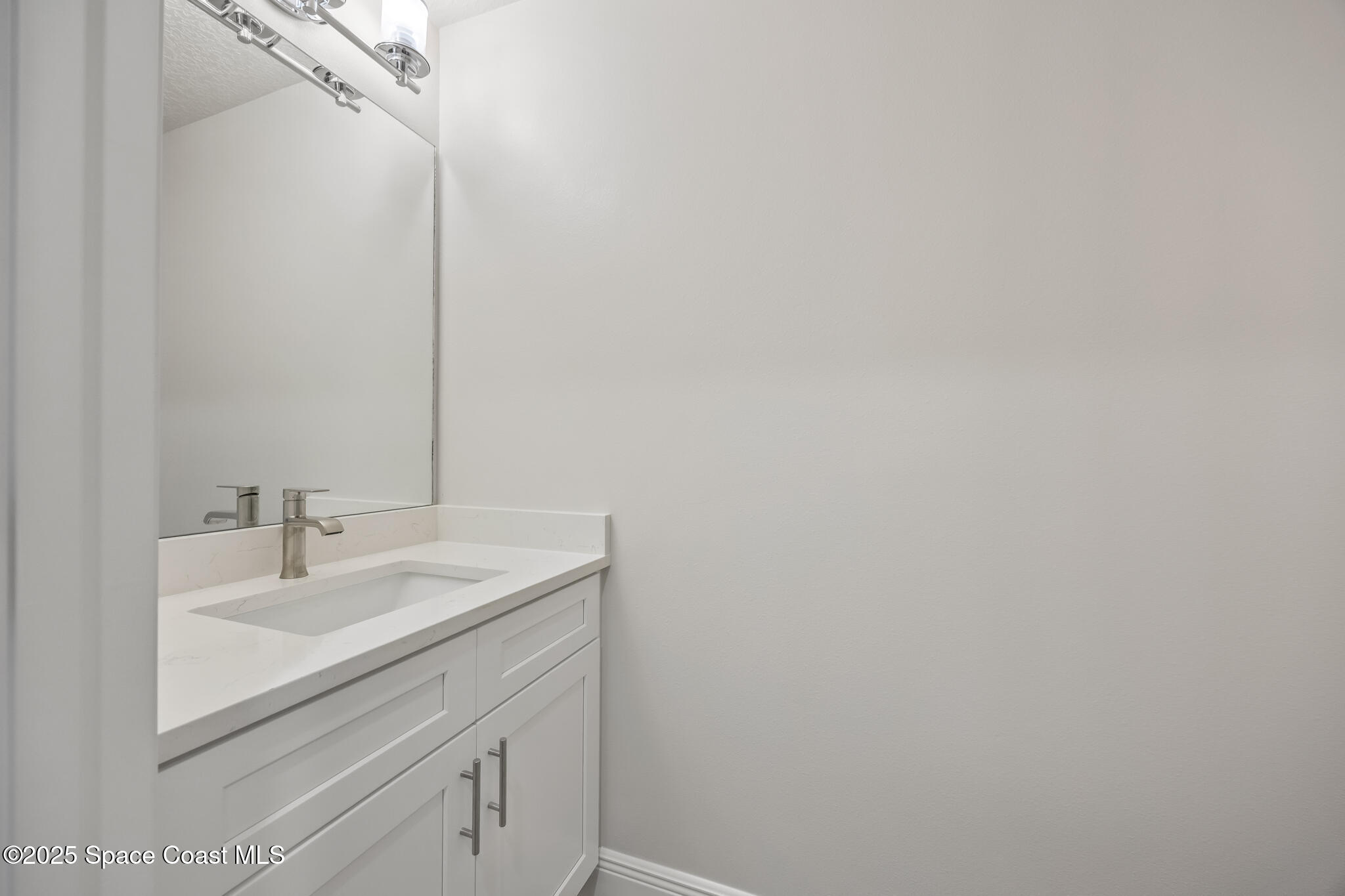 168 Hidden Wds Place Melbourne, FL 32901 - Photo 16 of 31 a bathroom with a sink and a mirror