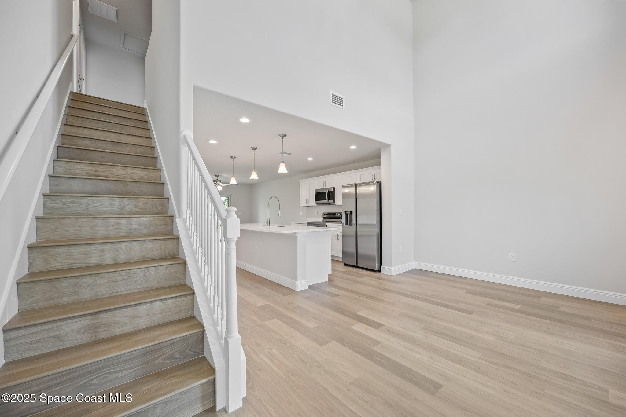 168 Hidden Wds Place Melbourne, FL 32901 - Photo 2 of 31 a view of entryway and hall with wooden floor