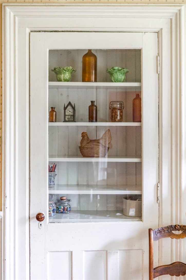 67 Fisk Road Bovina, NY 13753 - Photo 15 of 48 Historic charm radiates from this classic built-in cabinet featuring a glass pane door and molded trim.