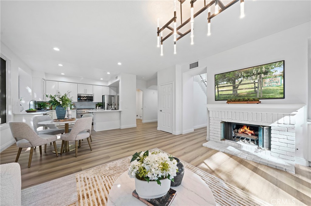 18 Broadleaf Irvine, CA 92612 - Photo 11 of 52 a living room with furniture and a fireplace