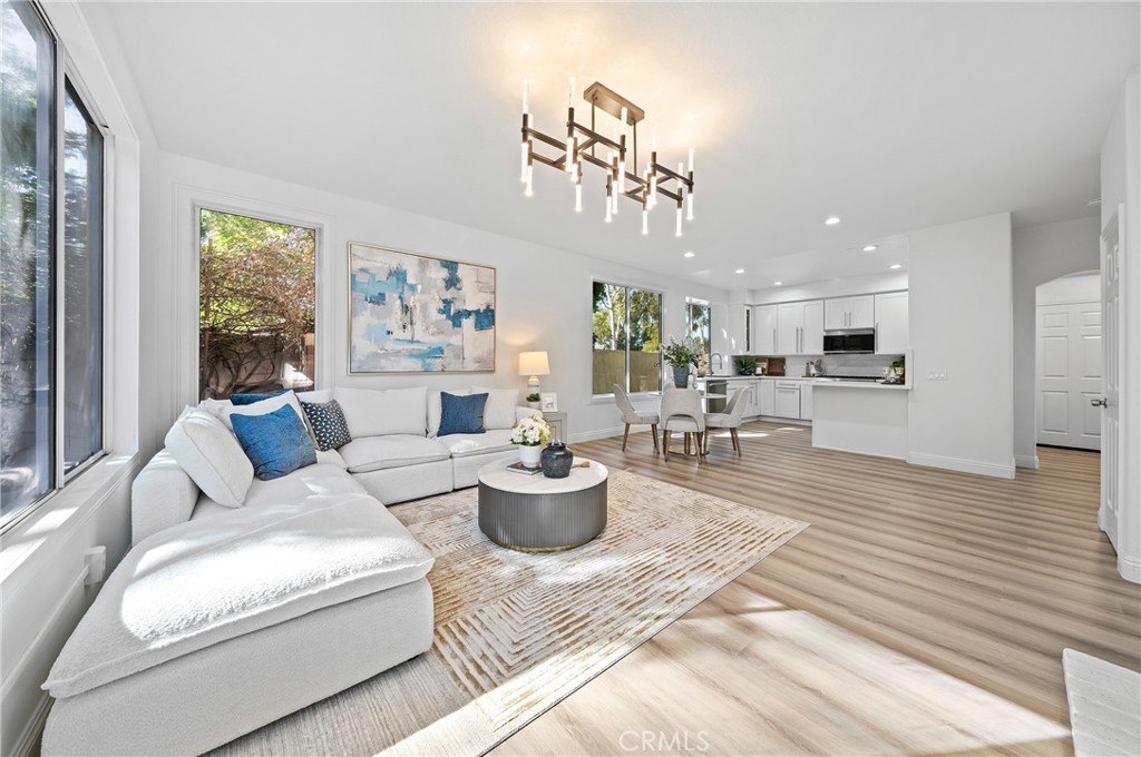 18 Broadleaf Irvine, CA 92612 - Photo 16 of 52 a living room with furniture and a large window