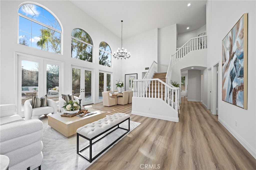 18 Broadleaf Irvine, CA 92612 - Photo 19 of 52 a living room with patio furniture and a wooden floor