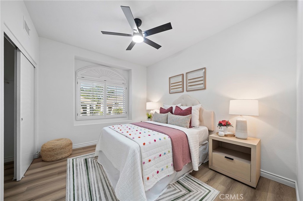 18 Broadleaf Irvine, CA 92612 - Photo 28 of 52 a bedroom with a large bed and a window