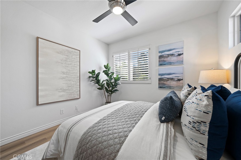 18 Broadleaf Irvine, CA 92612 - Photo 31 of 52 a bedroom with a bed and a window