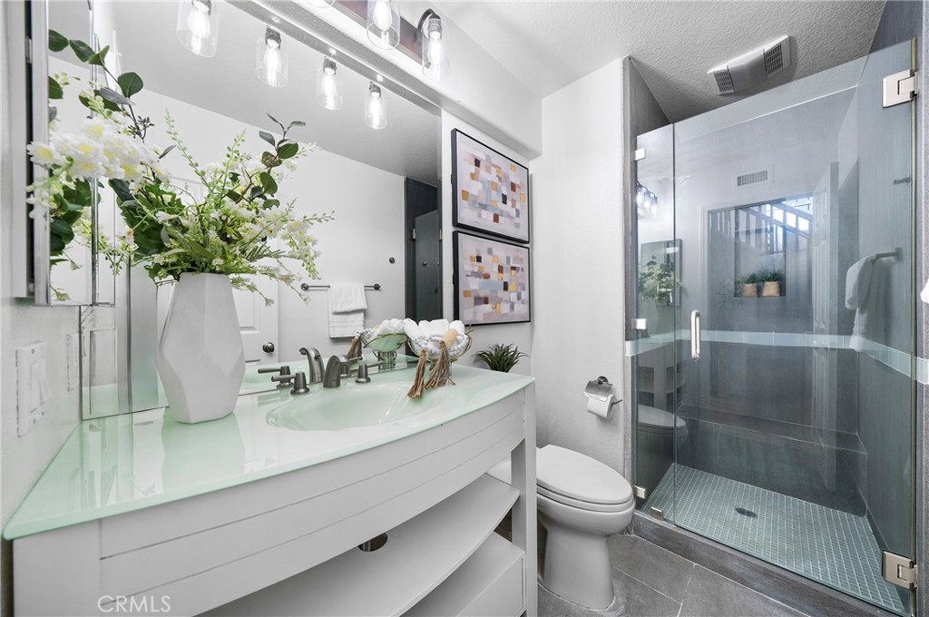 18 Broadleaf Irvine, CA 92612 - Photo 33 of 52 a bathroom with a sink a toilet and shower