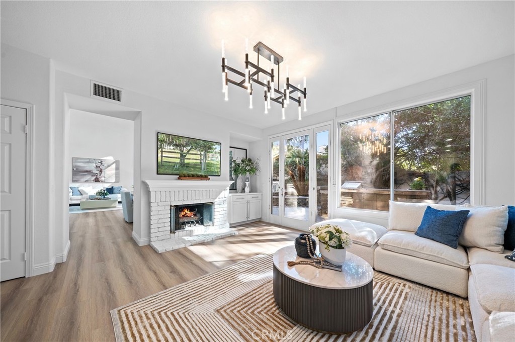 18 Broadleaf Irvine, CA 92612 - Photo 10 of 52 a living room with furniture and a fireplace