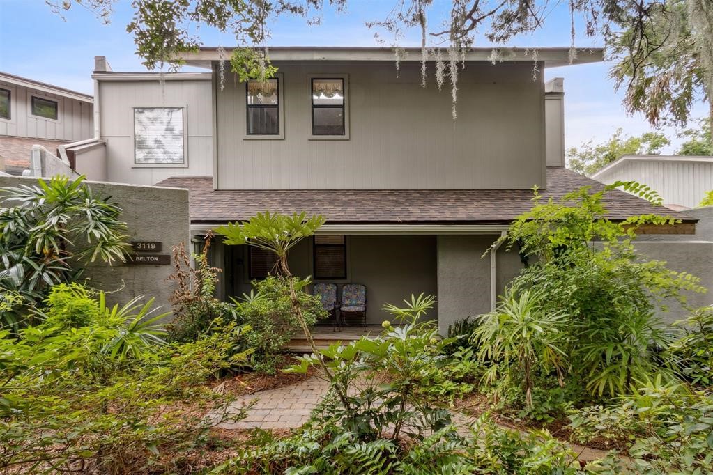 3119 Sea Marsh Road Fernandina Beach, FL 32034 - Photo 2 of 41 a front view of a house with garden