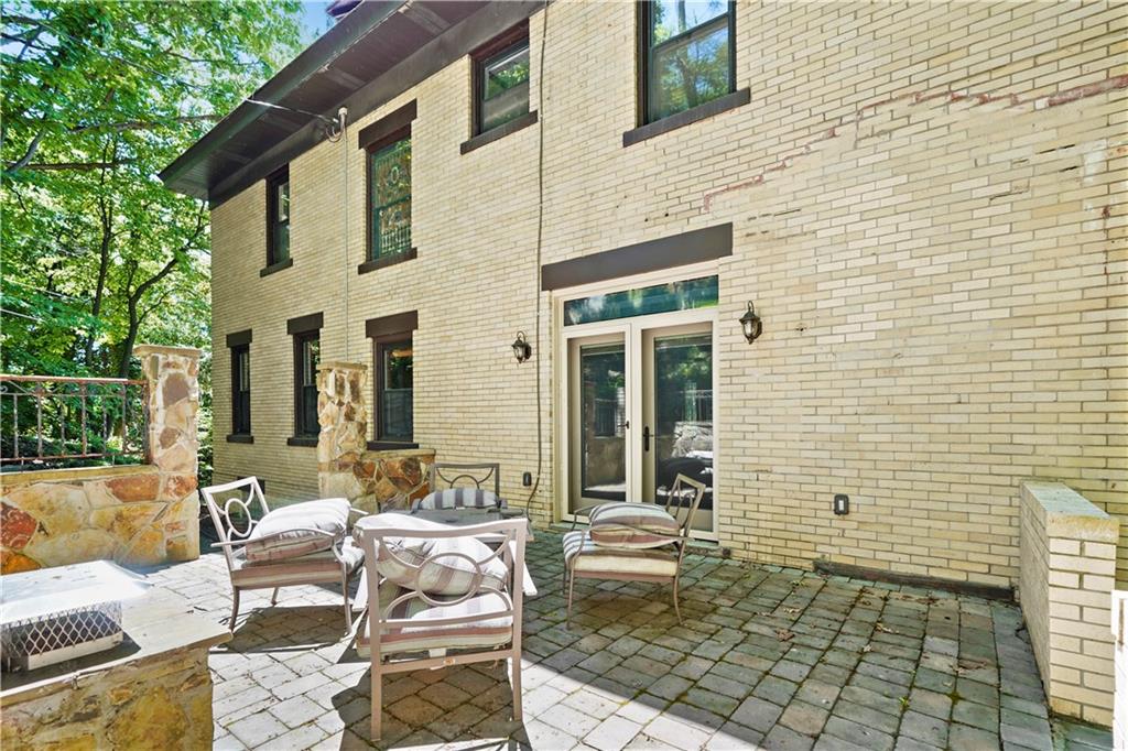114 East Waldheim Road Pittsburgh, PA 15215 - Photo 4 of 25 Side patio boasts an outside fireplace