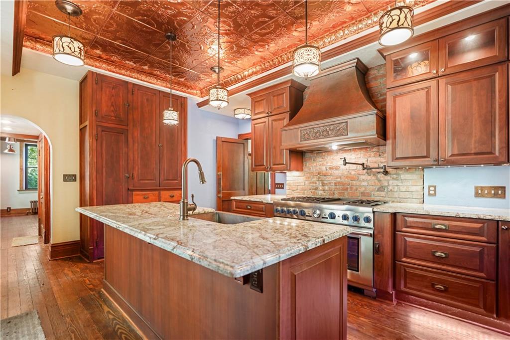 114 East Waldheim Road Pittsburgh, PA 15215 - Photo 10 of 25 Viking Gas Range with Pot spigot, copper vent hood, copper ceiling with recessed lights. Toe kick lights and under the counter lights.