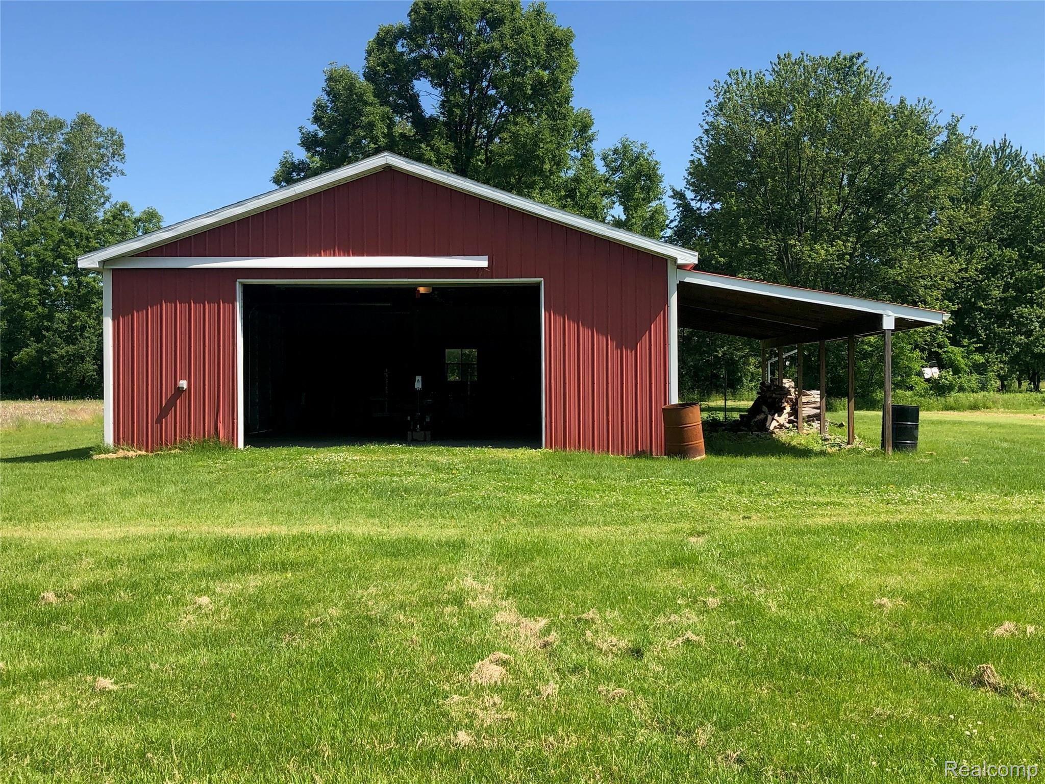 3663 Kilgore Road Avoca, MI 48006 - Photo 38 of 57 Pole barn with 10 ft. tall door with opener, electric and cement floor