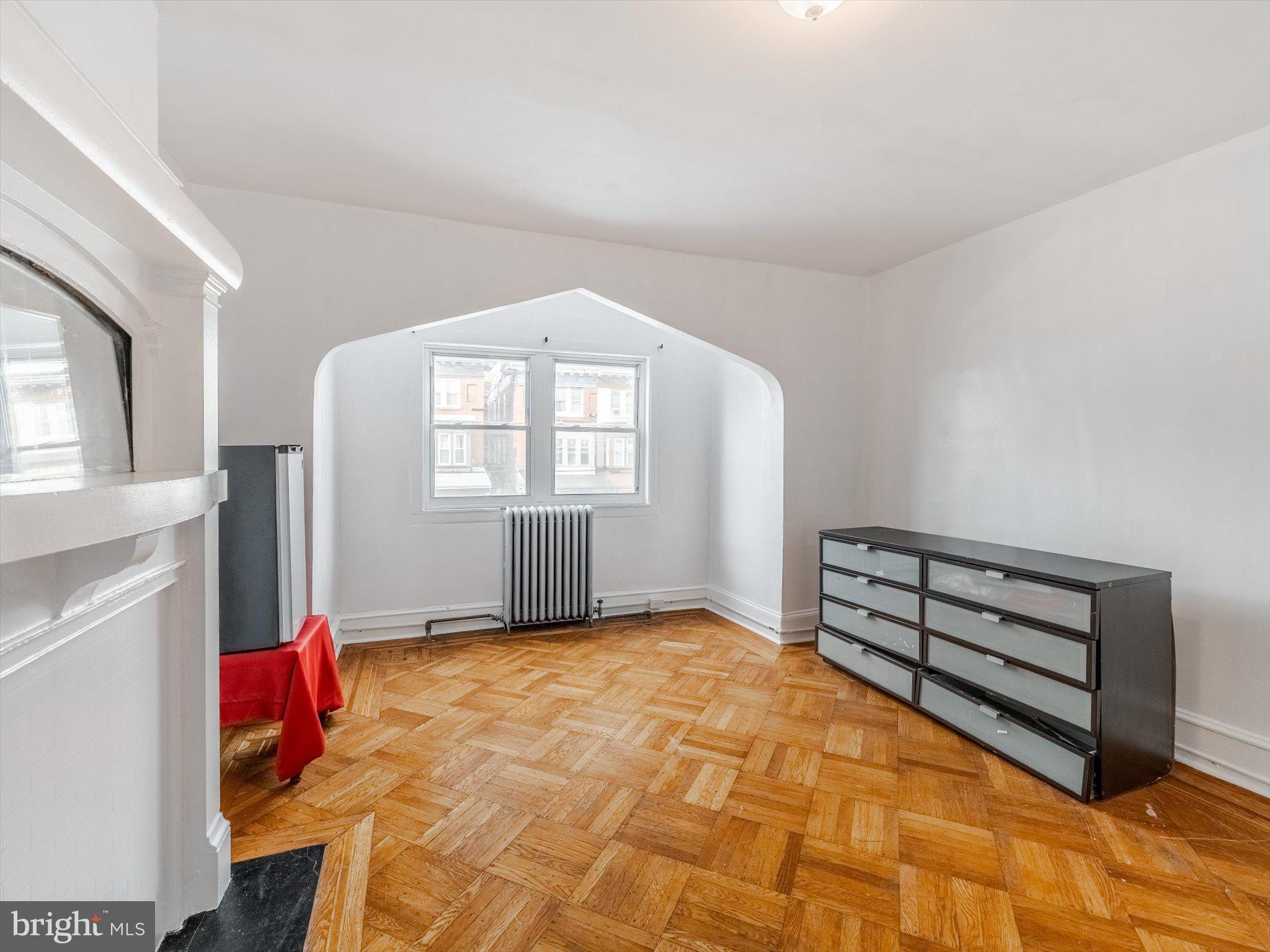 131 South 50th Street Philadelphia, PA 19139 - Photo 15 of 27 a living room with furniture and a window