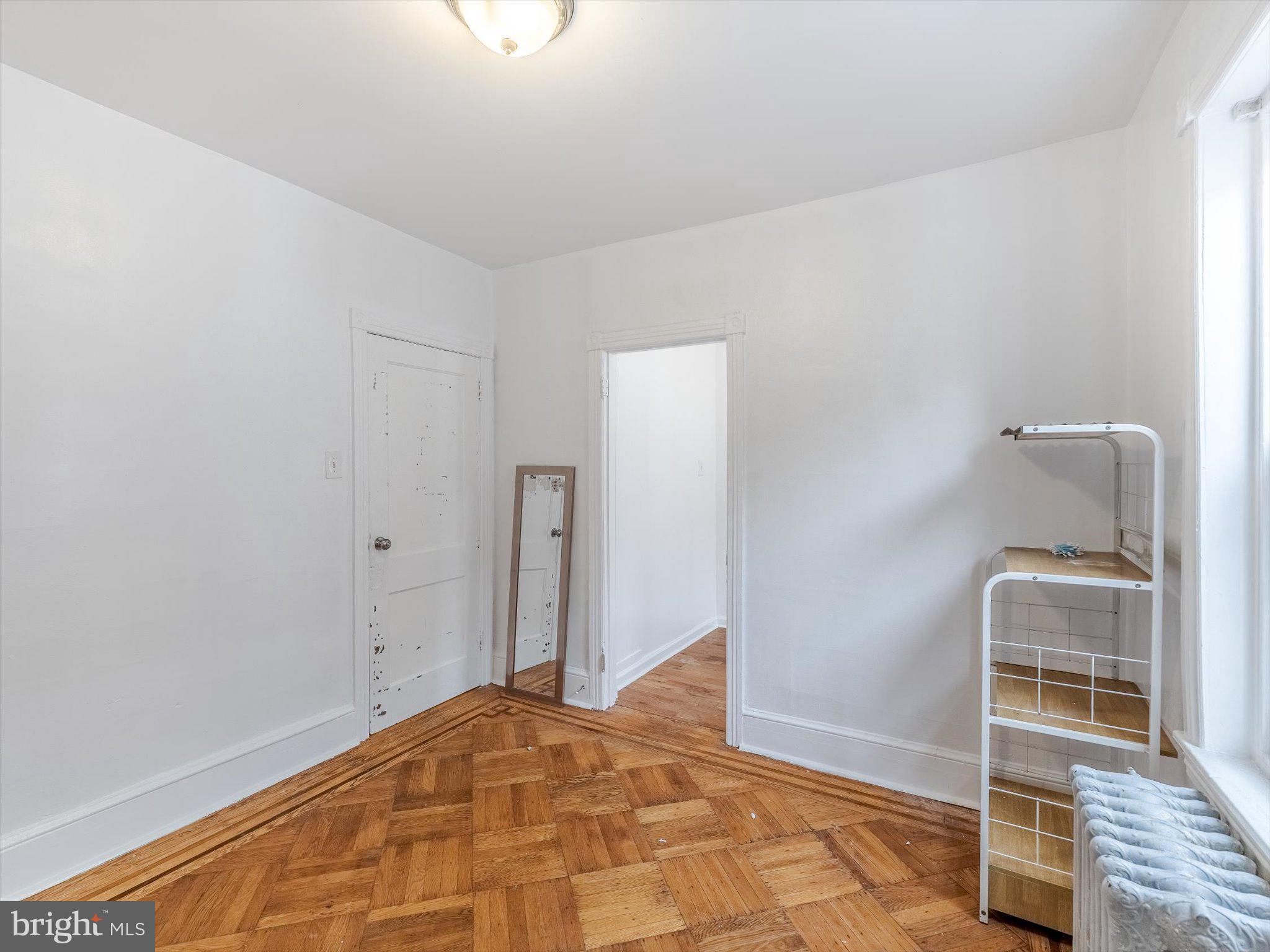 131 South 50th Street Philadelphia, PA 19139 - Photo 22 of 27 a view of a room with wooden floor and bedroom