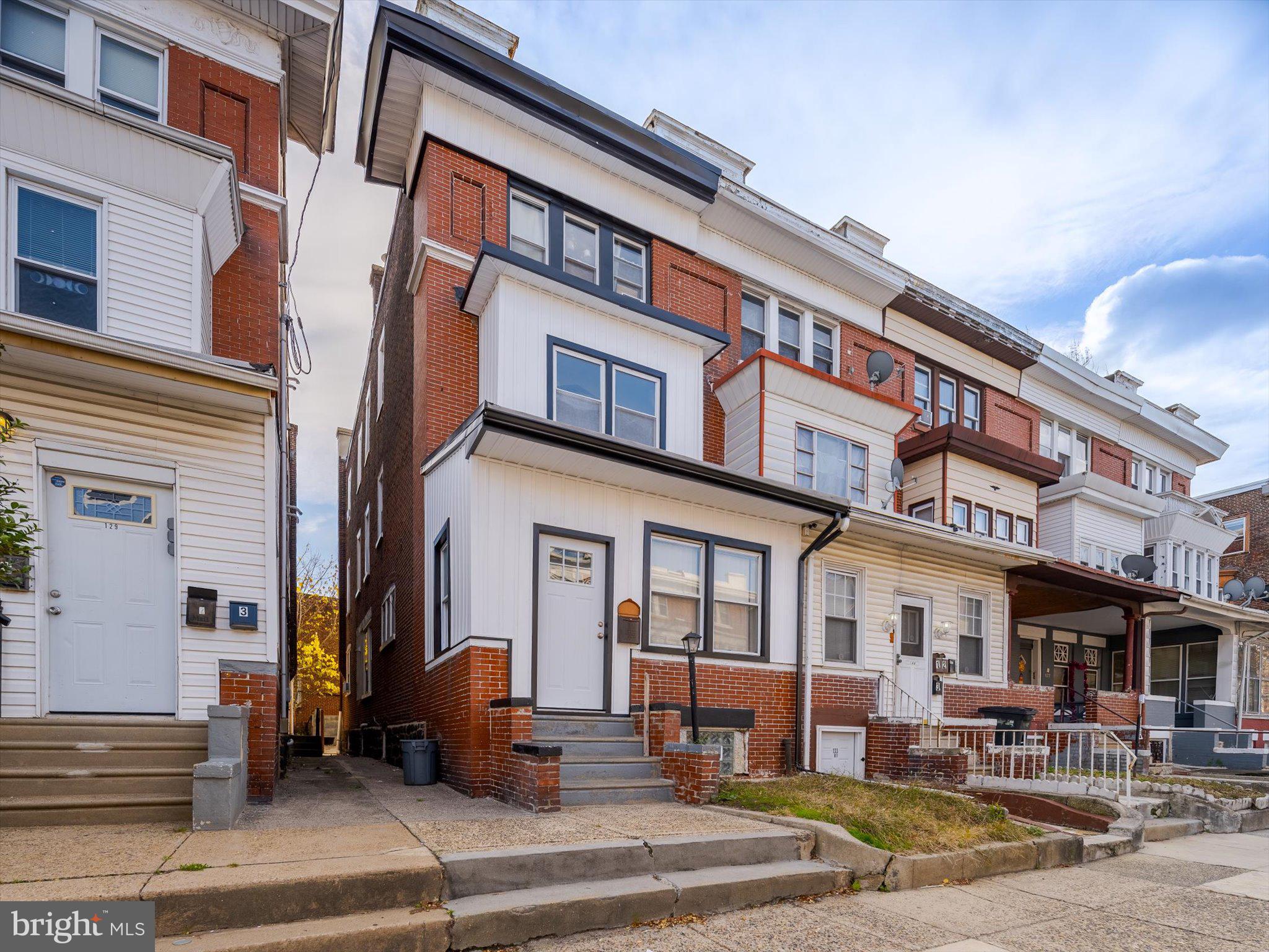 131 South 50th Street Philadelphia, PA 19139 - Photo 4 of 27 a front view of a building and car parked