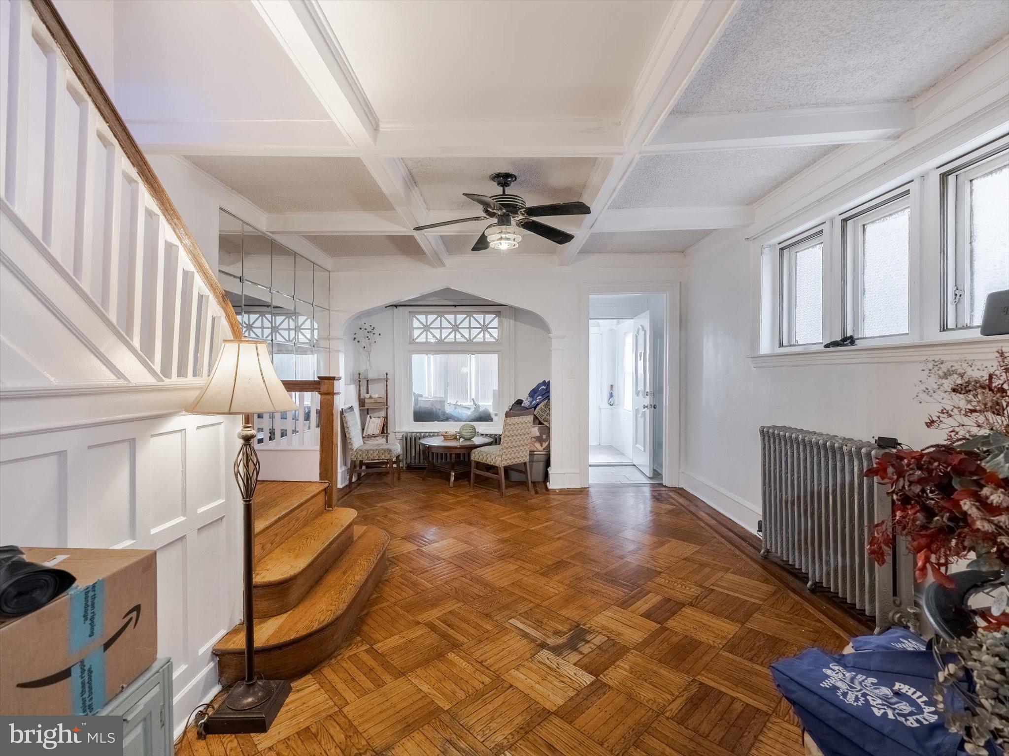 131 South 50th Street Philadelphia, PA 19139 - Photo 9 of 27 a living room with furniture and a chandelier