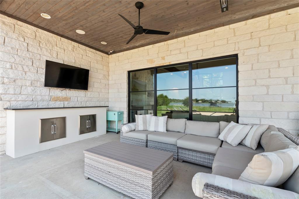111 Sun Valley Mabank, TX 75147 - Photo 29 of 40 Covered patio with comfortable seating and mounted TV.
