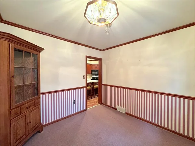a room with a wooden door and a shower curtain