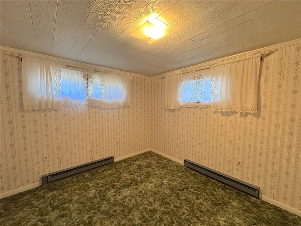 776 Highway 271 Ligonier, PA 15658 - Photo 22 of 29 a room with a wooden door and a shower curtain