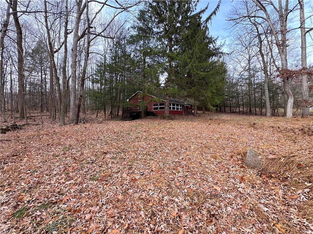 776 Highway 271 Ligonier, PA 15658 - Photo 25 of 29 a wooden house with trees in the background