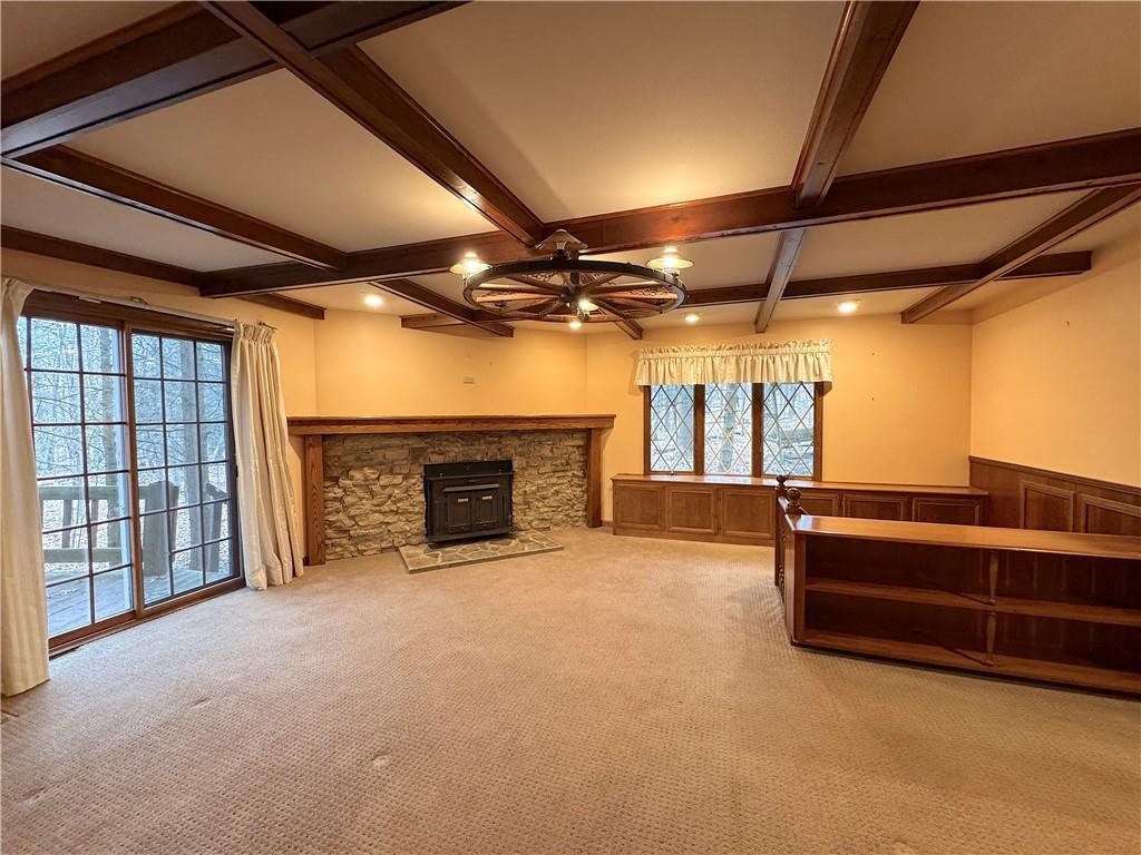 776 Highway 271 Ligonier, PA 15658 - Photo 6 of 29 a view of an empty room with a fireplace and a ceiling fan