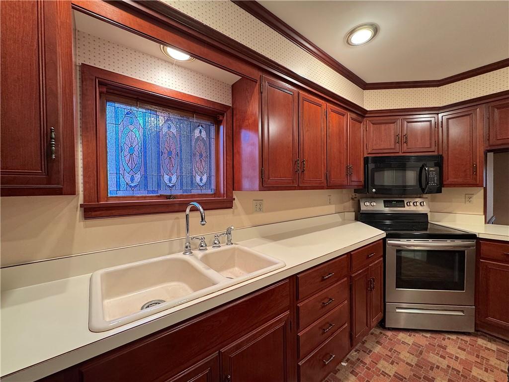 776 Highway 271 Ligonier, PA 15658 - Photo 10 of 29 a kitchen with stainless steel appliances granite countertop a sink stove and microwave