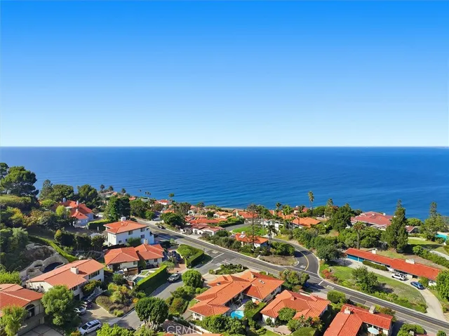 an aerial view of a houses with a lake view