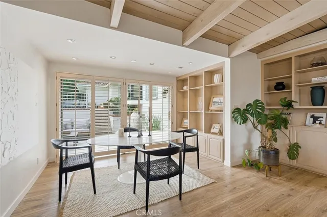 a view of a livingroom with furniture and a potted plant